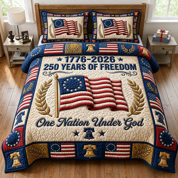 Liberty Legacy quilted 3-piece bedding set on a made bed in a warmly lit bedroom