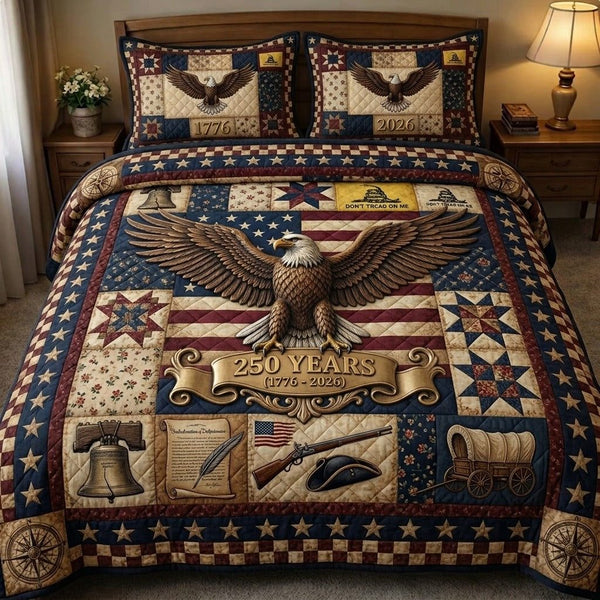 Liberty Legacy quilted 3-piece bedding set on a made bed in a warmly lit bedroom