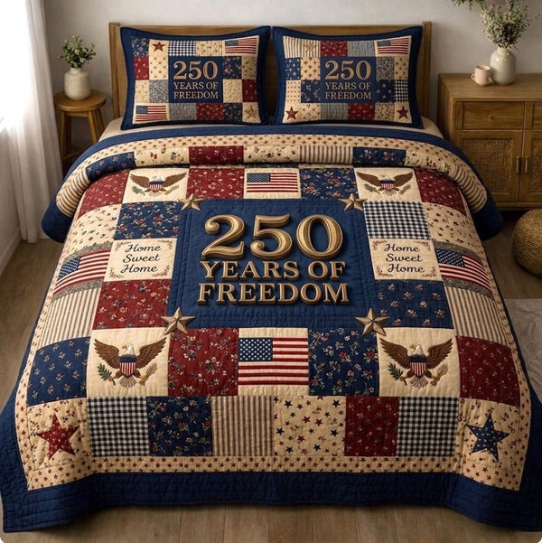 Liberty Legacy quilted 3-piece bedding set on a made bed in a warmly lit bedroom