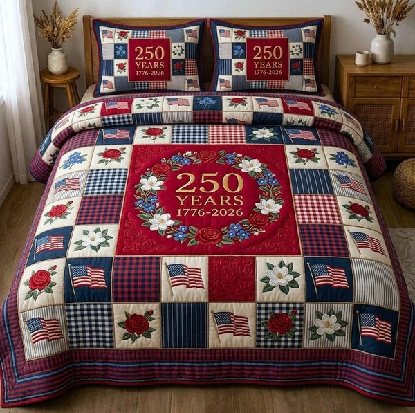 Liberty Legacy quilted 3-piece bedding set on a made bed in a warmly lit bedroom