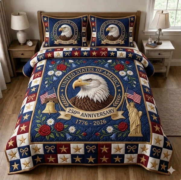 Liberty Legacy quilted 3-piece bedding set on a made bed in a warmly lit bedroom