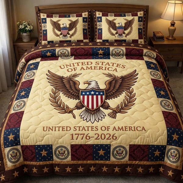 Liberty Legacy quilted 3-piece bedding set on a made bed in a warmly lit bedroom