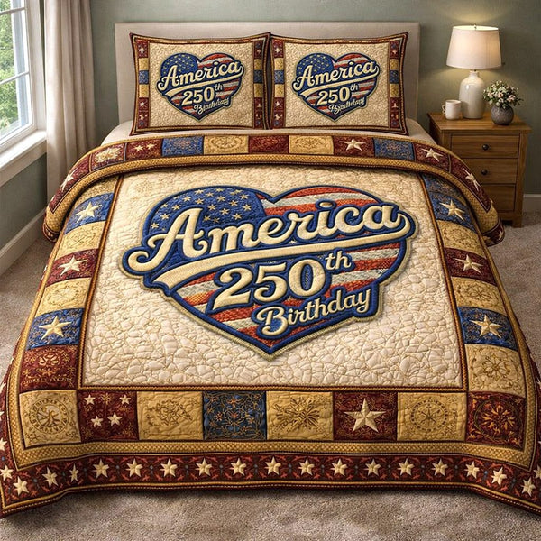 Liberty Legacy quilted 3-piece bedding set on a made bed in a warmly lit bedroom
