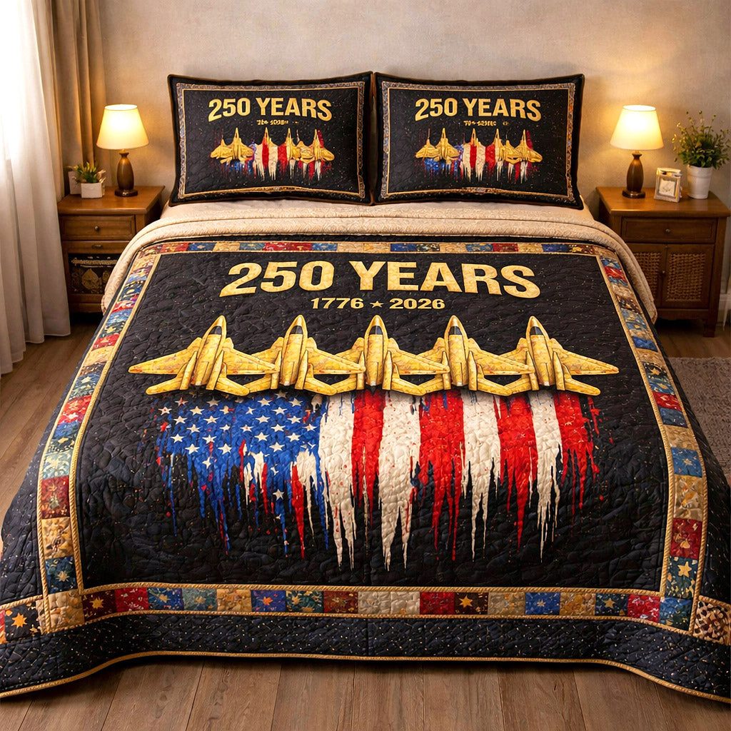 Liberty Legacy quilted 3-piece bedding set on a made bed in a warmly lit bedroom