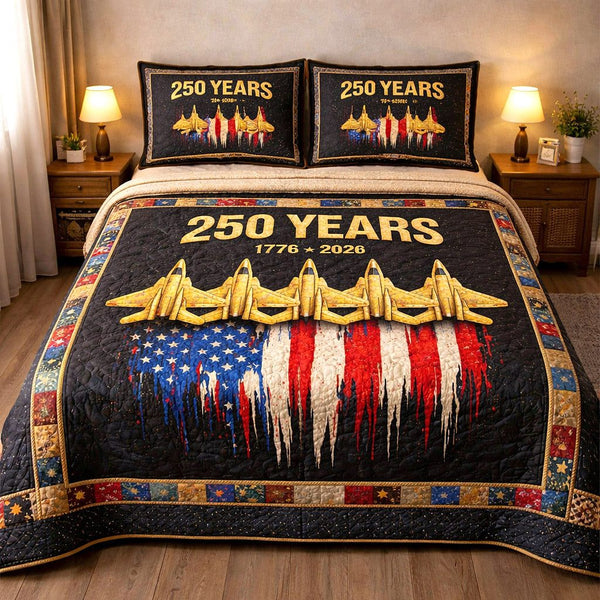 Liberty Legacy quilted 3-piece bedding set on a made bed in a warmly lit bedroom