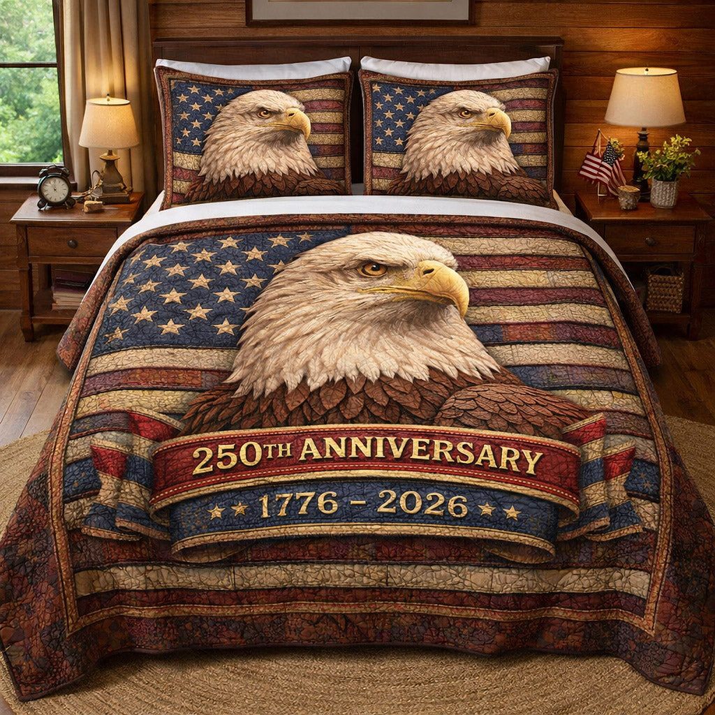 Liberty Legacy quilted 3-piece bedding set on a made bed in a warmly lit bedroom