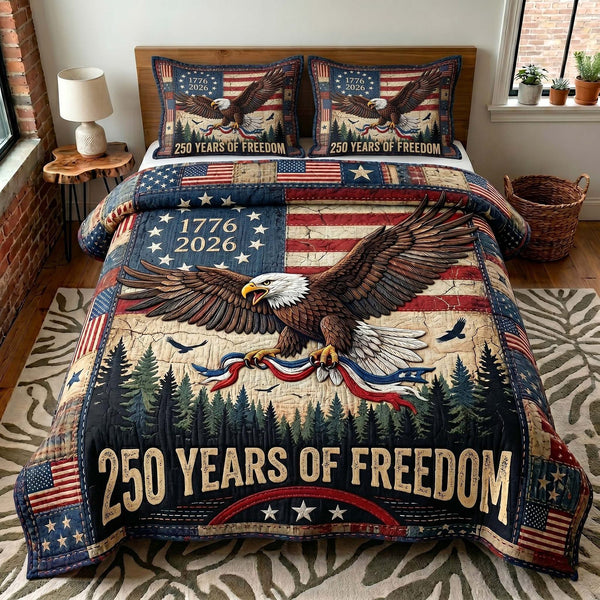 Liberty Legacy quilted 3-piece bedding set on a made bed in a warmly lit bedroom
