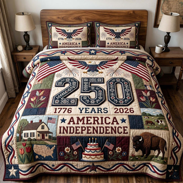Liberty Legacy quilted 3-piece bedding set on a made bed in a warmly lit bedroom