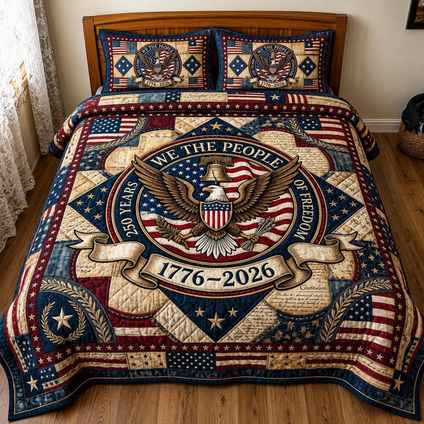 Liberty Patch quilted 3-piece bedding set on a made bed in a warmly lit bedroom