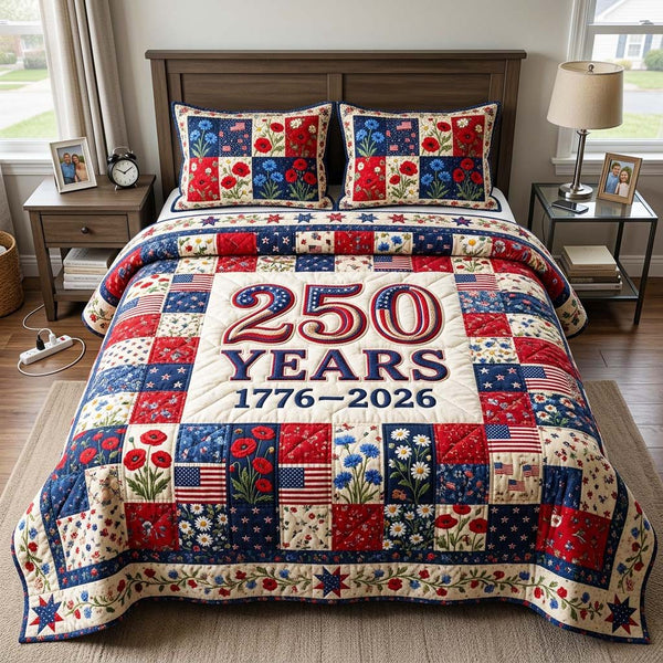 Liberty Patch quilted 3-piece bedding set on a made bed in a warmly lit bedroom