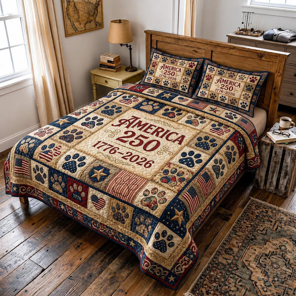 Liberty Paws quilted 3-piece bedding set on a made bed in a warmly lit bedroom