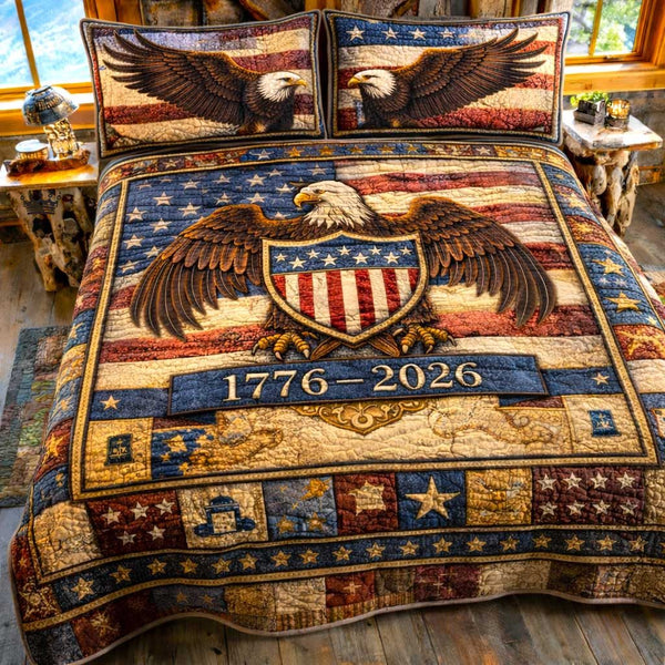 Liberty Spirit quilted 3-piece bedding set on a made bed in a warmly lit bedroom