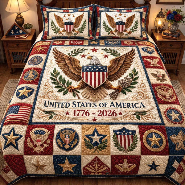 Liberty Spirit quilted 3-piece bedding set on a made bed in a warmly lit bedroom
