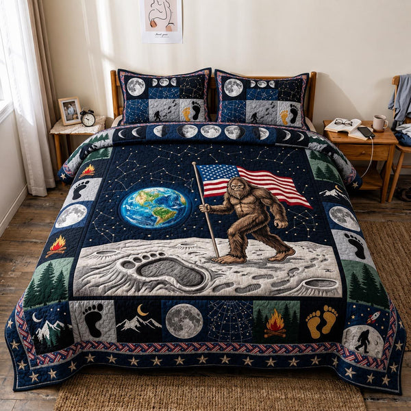Liberty Squatch quilted 3-piece bedding set on a made bed in a warmly lit bedroom
