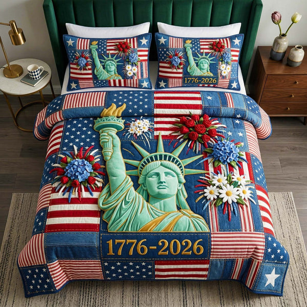 Liberty Statue quilted 3-piece bedding set on a made bed in a warmly lit bedroom