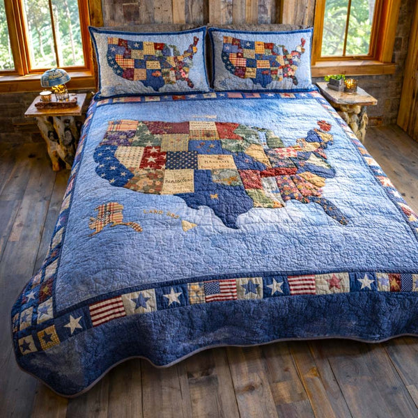 Liberty Tones quilted 3-piece bedding set on a made bed in a warmly lit bedroom