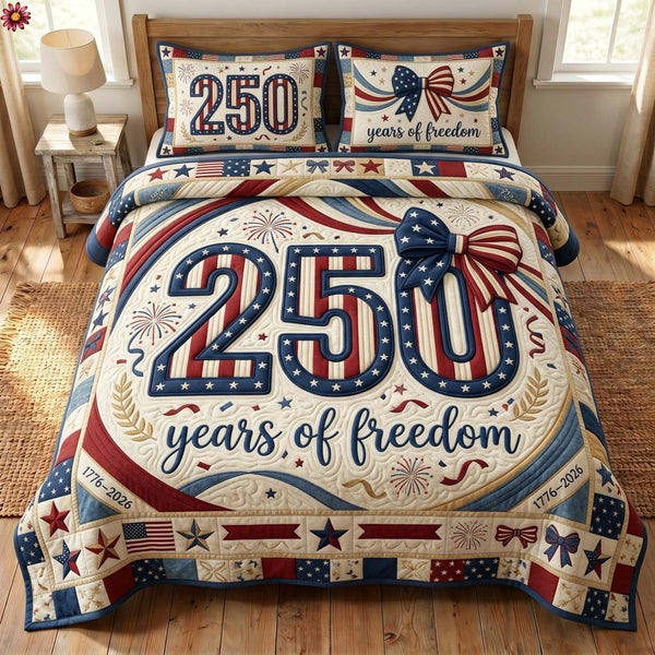 Liberty Voyage quilted 3-piece bedding set on a made bed in a warmly lit bedroom