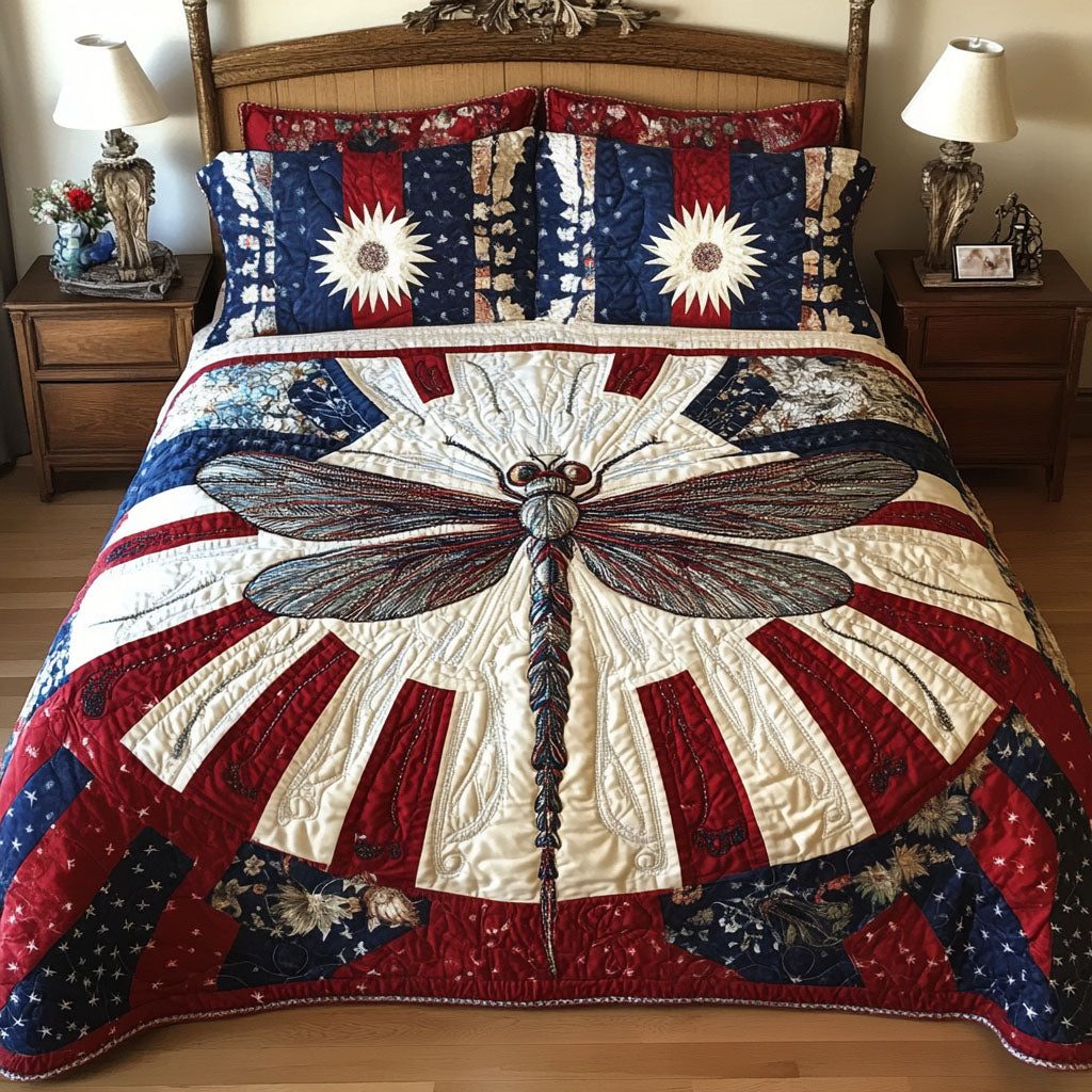 Liberty Wings quilted 3-piece bedding set on a made bed in a warmly lit bedroom