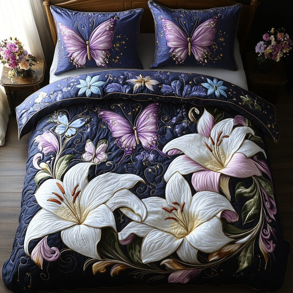 Lilies Wings quilted 3-piece bedding set on a made bed with two matching pillow shams