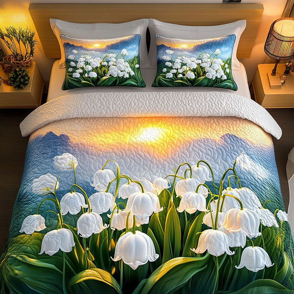Lily Glow quilted 3-piece bedding set on a made bed with two matching pillow shams