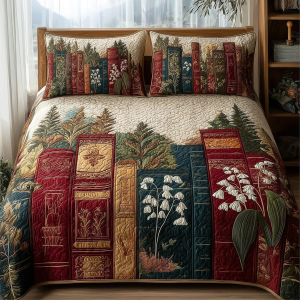 Lily Of The Valley Bookworm quilted 3-piece bedding set on a made bed with two matching pillow shams