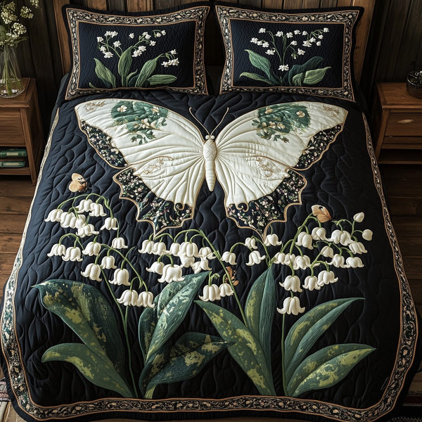 Lily of The Valley quilted 3-piece bedding set on a made bed with two matching pillow shams