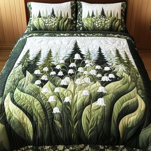 Lily Of The Valley quilted 3-piece bedding set on a made bed with two matching pillow shams