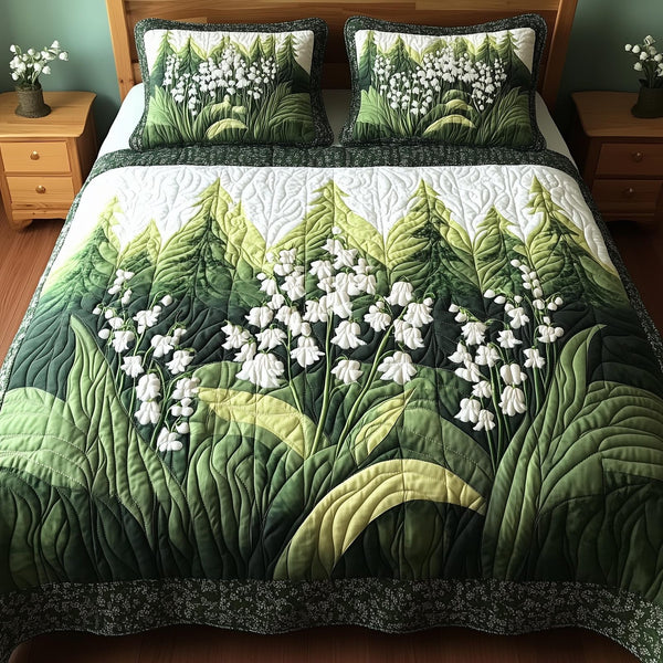 Lily Of The Valley quilted 3-piece bedding set on a made bed with two matching pillow shams