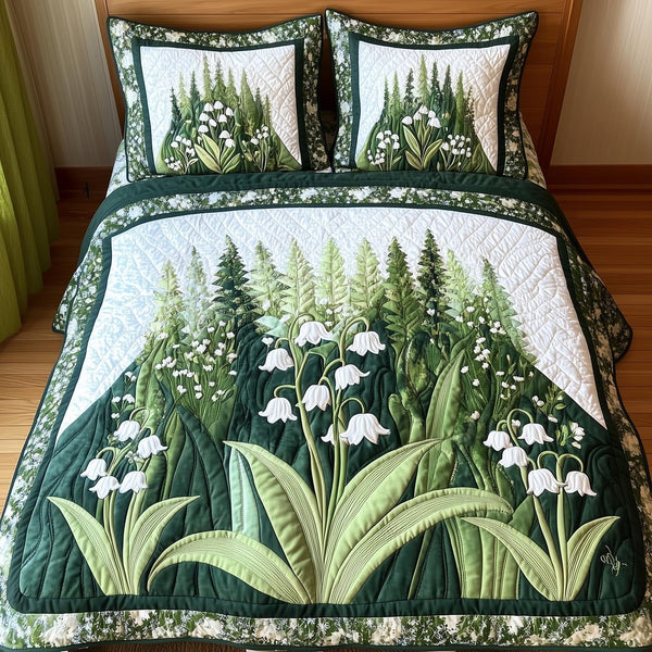 Lily Of The Valley quilted 3-piece bedding set on a made bed with two matching pillow shams
