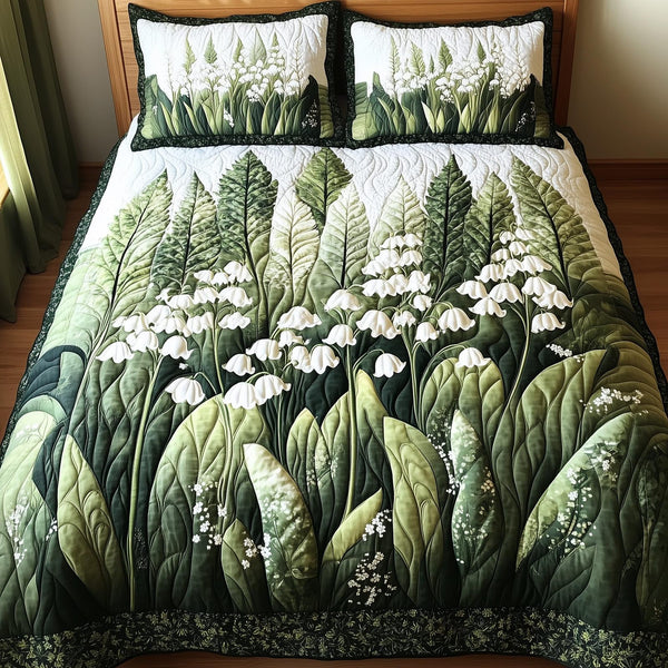 Lily Of The Valley quilted 3-piece bedding set on a made bed with two matching pillow shams