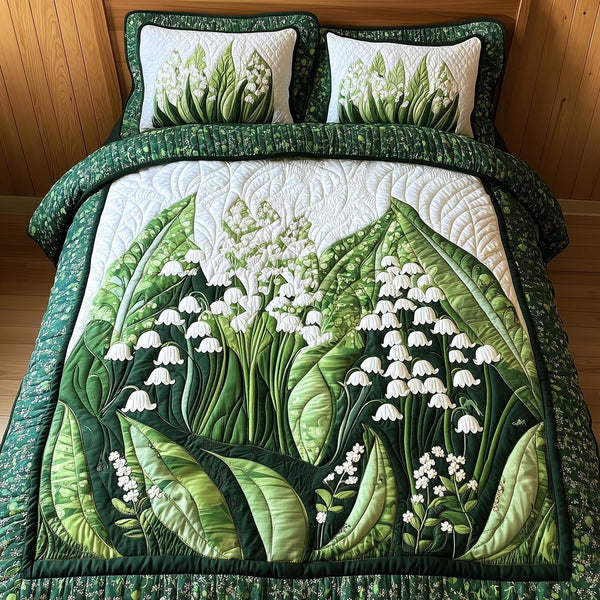 Lily Of The Valley quilted 3-piece bedding set on a made bed with two matching pillow shams
