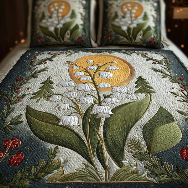 Lily Of The Valley quilted 3-piece bedding set on a made bed with two matching pillow shams
