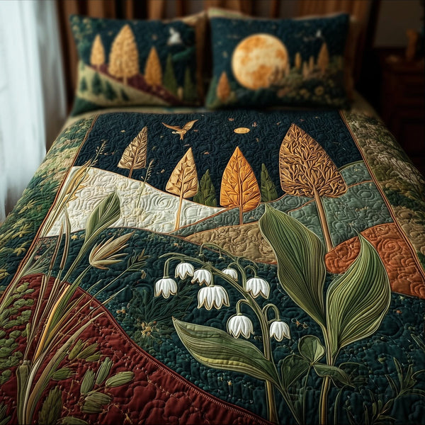 Lily Of The Valley quilted 3-piece bedding set on a made bed with two matching pillow shams