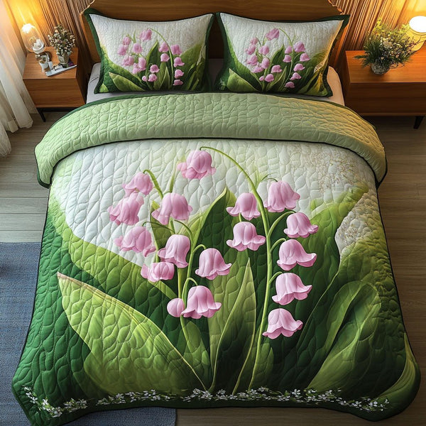 Lily Tranquility quilted 3-piece bedding set on a made bed with two matching pillow shams