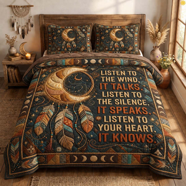 Listen Wind Spirit quilted 3-piece bedding set on a made bed with two matching pillow shams