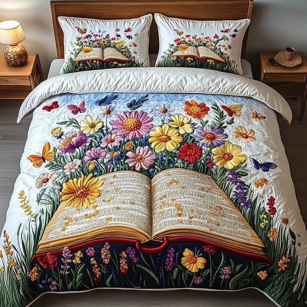 Literary Bloom quilted 3-piece bedding set on a made bed with two matching pillow shams
