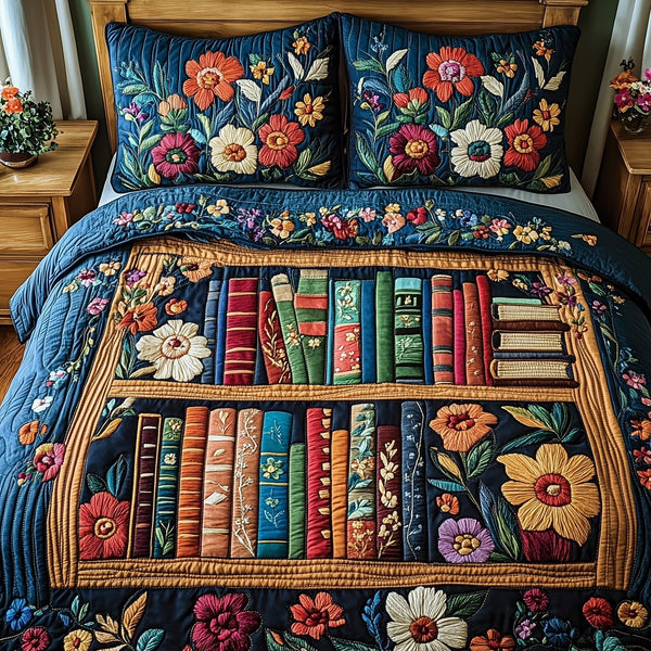 Literary Haven quilted 3-piece bedding set on a made bed with two matching pillow shams
