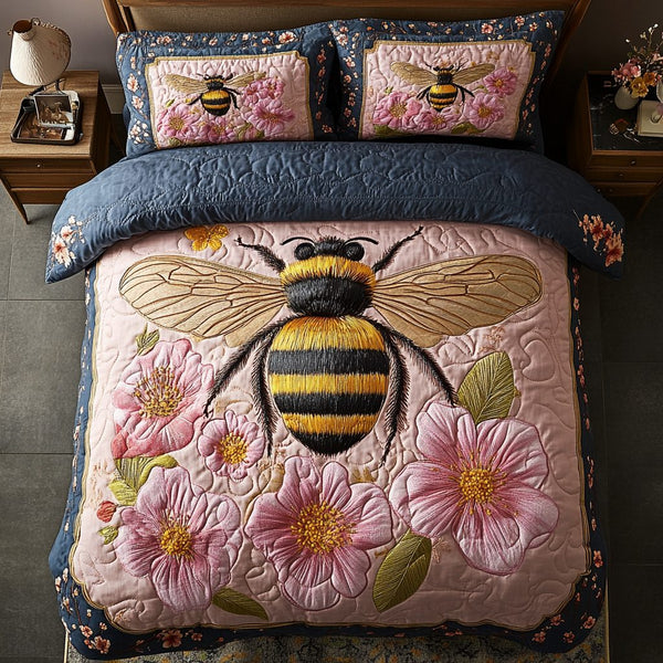 Little Bee quilted 3-piece bedding set on a made bed with two matching pillow shams