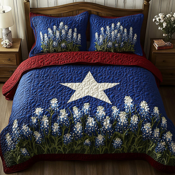 Lone Star Blossoms quilted 3-piece bedding set on a made bed with two matching pillow shams