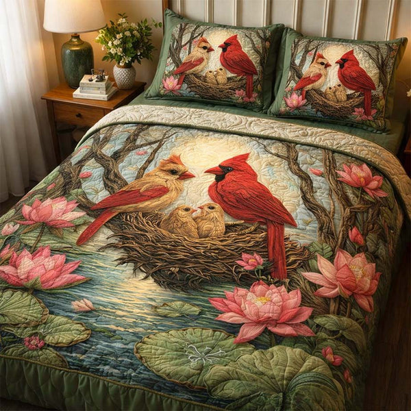 Lotus Nest Cardinals quilted 3-piece bedding set on a made bed with two matching pillow shams