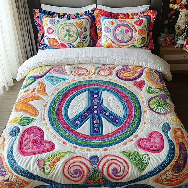 Love and Peace quilted 3-piece bedding set on a made bed with two matching pillow shams