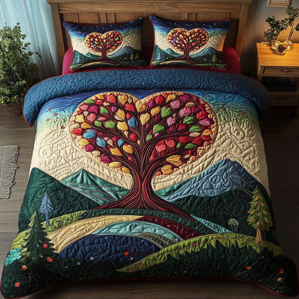 Love Canopy quilted 3-piece bedding set on a made bed with two matching pillow shams