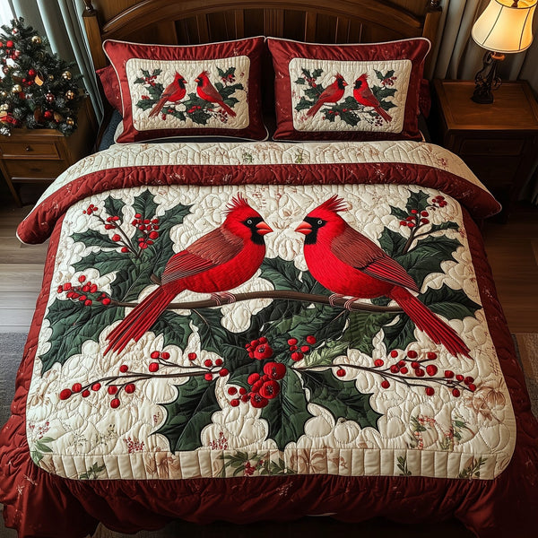Love Cardinal quilted 3-piece bedding set on a made bed with two matching pillow shams