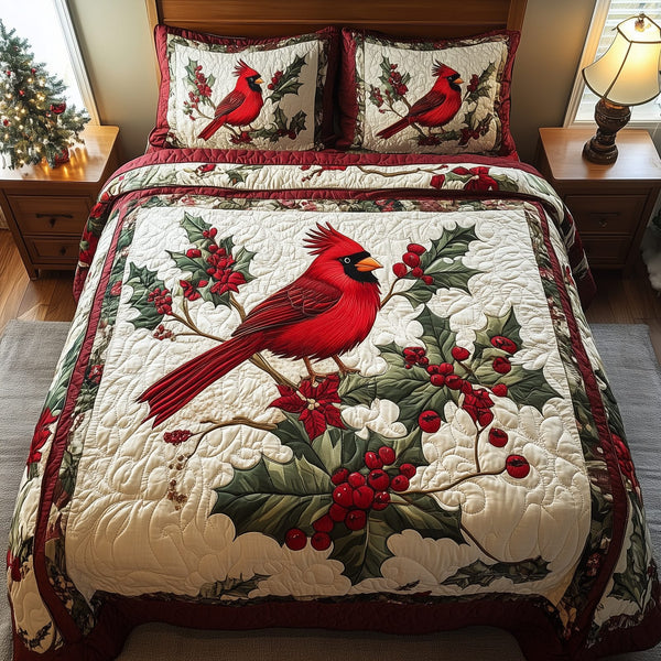 Love Cardinal quilted 3-piece bedding set on a made bed with two matching pillow shams
