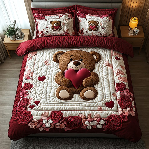 Love Cuddle quilted 3-piece bedding set on a made bed with two matching pillow shams