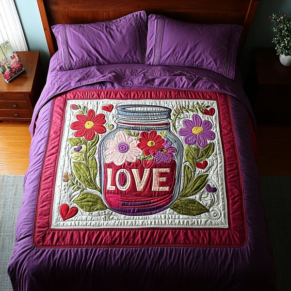 Love in Full Bloom quilted 3-piece bedding set on a made bed with two matching pillow shams