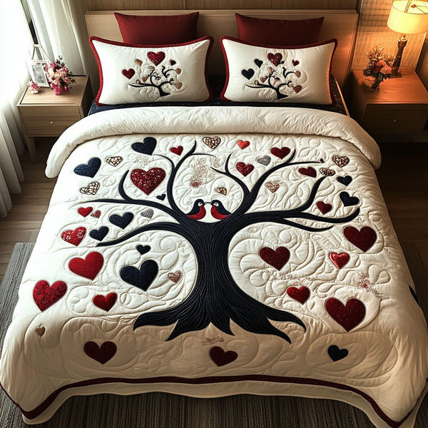 Love in the Canopy quilted 3-piece bedding set on a made bed with two matching pillow shams