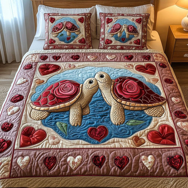 Love in the Sand quilted 3-piece bedding set on a made bed with two matching pillow shams