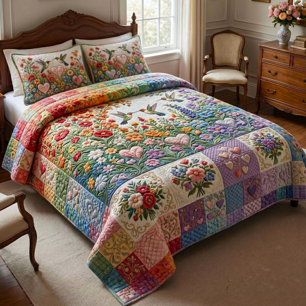 Love is Love quilted 3-piece bedding set on a made bed with two matching pillow shams