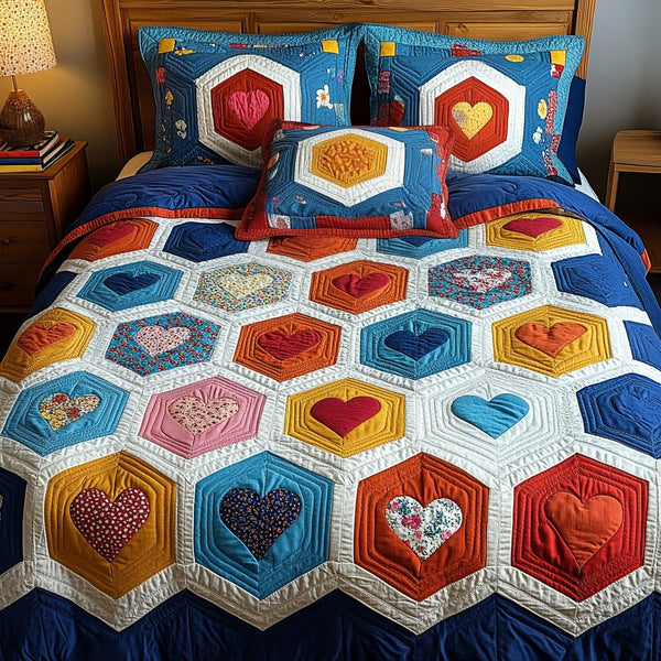 Love Layers quilted 3-piece bedding set on a made bed with two matching pillow shams